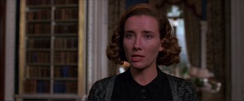 Movie still from “The Remains of the Day” (1993), directed by James Ivory – A person wearing a black shirt; Close Up shot, Over the shoulder angle