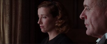 Movie still from “The Remains of the Day” (1993), directed by James Ivory – A person wearing a black shirt; Close Up shot, Low angle