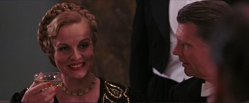 Movie still from “The Remains of the Day” (1993), directed by James Ivory – A woman in a black dress and a man in a black suit; Close Up shot, Over the shoulder angle