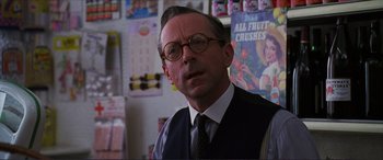 Movie still from “The Remains of the Day” (1993), directed by James Ivory – An older man wearing glasses and a tie; Close Up shot, Over the shoulder angle