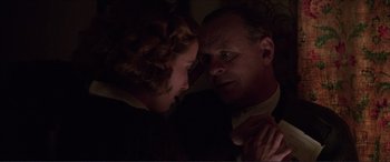 Movie still from “The Remains of the Day” (1993), directed by James Ivory – A man and a woman looking at one another; Close Up shot, Low angle