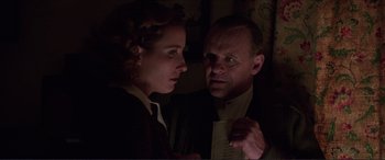 Movie still from “The Remains of the Day” (1993), directed by James Ivory – A man and a woman looking at one another; Close Up shot, Low angle