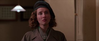 Movie still from “The Remains of the Day” (1993), directed by James Ivory – A person wearing a hat and a coat; Close Up shot, Low angle