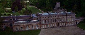 Movie still from “The Remains of the Day” (1993), directed by James Ivory – An aerial view of an old building in the middle of a park; Extreme Wide shot, High angle