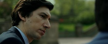 Movie still from “The Report” (2019), directed by Scott Z. Burns – A man's face with trees in the background; Close Up shot, Over the shoulder angle