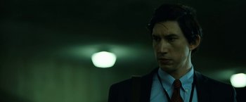 Movie still from “The Report” (2019), directed by Scott Z. Burns – A person wearing a suit and tie; Close Up shot, Over the shoulder angle