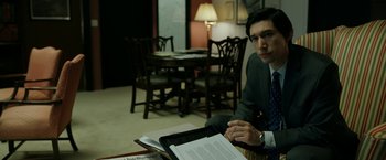 Movie still from “The Report” (2019), directed by Scott Z. Burns – A man sitting at a table in a room; Medium shot, High angle