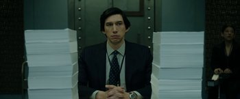 Movie still from “The Report” (2019), directed by Scott Z. Burns – A man in a suit and tie; Medium shot, Low angle