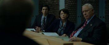 Movie still from “The Report” (2019), directed by Scott Z. Burns – A man and a woman are sitting at a table; Medium shot, Over the shoulder angle