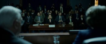 Movie still from “The Report” (2019), directed by Scott Z. Burns – A group of people sitting around a table; Wide shot, Over the shoulder angle