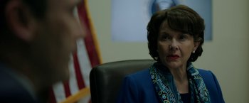 Movie still from “The Report” (2019), directed by Scott Z. Burns – A person sitting in a chair; Close Up shot, Over the shoulder angle
