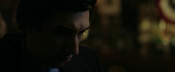 Movie still from “The Report” (2019), directed by Scott Z. Burns – A person's face in the dark; Close Up shot, Low angle