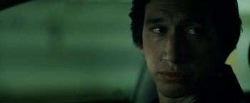Movie still from “The Report” (2019), directed by Scott Z. Burns – A young man's face in a car; Close Up shot, Low angle