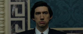 Movie still from “The Report” (2019), directed by Scott Z. Burns – A person wearing a suit and tie; Close Up shot, Low angle