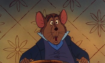Movie still from “The Rescuers” (1977), directed by Wolfgang Reitherman – A cartoon of a mouse wearing a blue jacket and looking surprised; Close Up shot, High angle