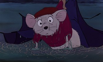 Movie still from “The Rescuers” (1977), directed by Wolfgang Reitherman – A cartoon of a mouse in a red shirt and a red hat; Medium shot, High angle