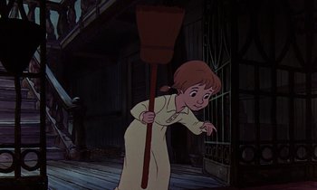 Movie still from “The Rescuers” (1977), directed by Wolfgang Reitherman – A young boy holding a broom while standing on a porch; Wide shot, Low angle