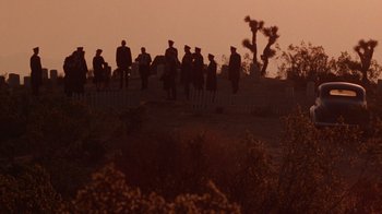 Movie still from “The Right Stuff” (1983), directed by Philip Kaufman – A group of people standing on top of a hill; Extreme Wide shot, High angle