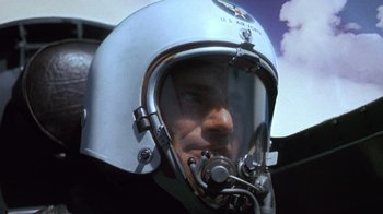 Movie still from “The Right Stuff” (1983), directed by Philip Kaufman – A man wearing a helmet; Close Up shot, Low angle