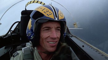 Movie still from “The Right Stuff” (1983), directed by Philip Kaufman – A person wearing a pilot's helmet; Close Up shot, Low angle