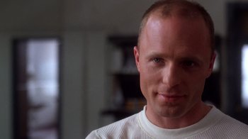 Movie still from “The Right Stuff” (1983), directed by Philip Kaufman – A person wearing a white shirt; Close Up shot, Low angle