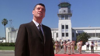 Movie still from “The Right Stuff” (1983), directed by Philip Kaufman – A man standing in front of a group of people; Medium shot, Low angle