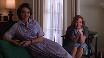 Movie still from “The Right Stuff” (1983), directed by Philip Kaufman – Two women sitting next to each other in front of a window; Medium shot, Low angle