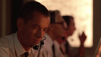 Movie still from “The Right Stuff” (1983), directed by Philip Kaufman – A man in a white shirt and a tie; Close Up shot, Low angle