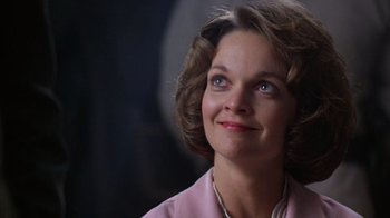 Movie still from “The Right Stuff” (1983), directed by Philip Kaufman – A person wearing a pink shirt; Close Up shot, Low angle