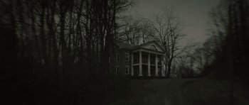 Movie still from “The Road” (2009), directed by John Hillcoat – An old house in the middle of the woods; Extreme Wide shot, Low angle