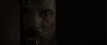 Movie still from “The Road” (2009), directed by John Hillcoat – A person with a beard; Extreme Close Up shot, Over the shoulder angle