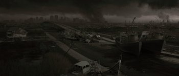 Movie still from “The Road” (2009), directed by John Hillcoat – An image of an abandoned city in the middle of the night; Extreme Wide shot, High angle