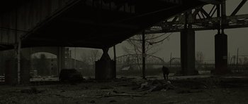 Movie still from “The Road” (2009), directed by John Hillcoat – An abandoned train station in the middle of the night; Extreme Wide shot, High angle