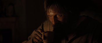 Movie still from “The Road” (2009), directed by John Hillcoat – A man holding a cup in his hands; Close Up shot, Over the shoulder angle