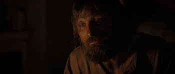 Movie still from “The Road” (2009), directed by John Hillcoat – A man with long hair and a long beard; Close Up shot, Over the shoulder angle