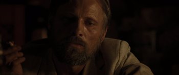 Movie still from “The Road” (2009), directed by John Hillcoat – A person with a beard; Close Up shot, Over the shoulder angle