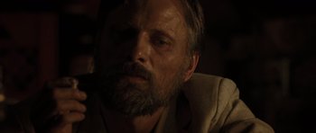 Movie still from “The Road” (2009), directed by John Hillcoat – A person with a beard; Close Up shot, Over the shoulder angle