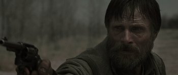 Movie still from “The Road” (2009), directed by John Hillcoat – A person with a beard; Close Up shot, Over the shoulder angle
