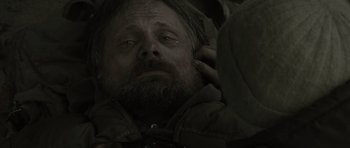 Movie still from “The Road” (2009), directed by John Hillcoat – A person wearing a jacket; Close Up shot, Over the shoulder angle