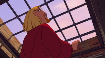 Movie still from “The Road to El Dorado” (2000), directed by Bibo Bergeron – A man with long blond hair is looking out of a window; Medium shot, Low angle