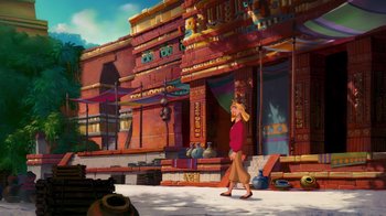 Movie still from “The Road to El Dorado” (2000), directed by Bibo Bergeron – A woman walking down a street in front of a building; Extreme Wide shot, High angle