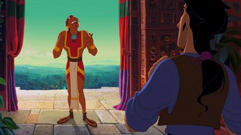 Movie still from “The Road to El Dorado” (2000), directed by Bibo Bergeron – A man and a woman are standing in front of a building; Wide shot, Over the shoulder angle