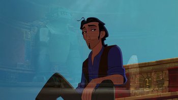 Movie still from “The Road to El Dorado” (2000), directed by Bibo Bergeron – A man sitting on the ground in front of a statue; Medium shot, High angle