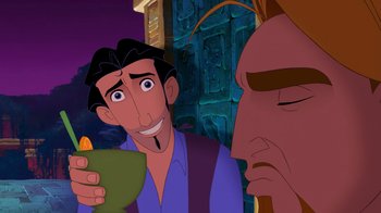 Movie still from “The Road to El Dorado” (2000), directed by Bibo Bergeron – A man holding a drink in front of another man; Close Up shot, Over the shoulder angle
