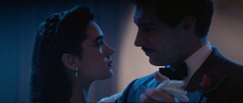 Movie still from “The Rocketeer” (1991), directed by Joe Johnston – A man and a woman looking at one another; Close Up shot, Low angle