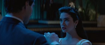 Movie still from “The Rocketeer” (1991), directed by Joe Johnston – A man and a woman are sitting in front of each other; Close Up shot, Over the shoulder angle