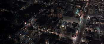 Movie still from “The Rocketeer” (1991), directed by Joe Johnston – An aerial view of a city at night with lights; Extreme Wide shot, High angle