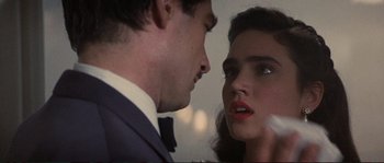 Movie still from “The Rocketeer” (1991), directed by Joe Johnston – A man and a woman looking at one another; Close Up shot, Over the shoulder angle