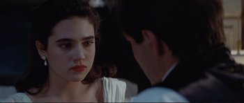 Movie still from “The Rocketeer” (1991), directed by Joe Johnston – A woman with red lipstick looking at a man with dark hair; Close Up shot, Over the shoulder angle