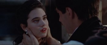 Movie still from “The Rocketeer” (1991), directed by Joe Johnston – A man and a woman looking at one another; Close Up shot, Over the shoulder angle